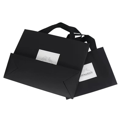 OEM สีดำสีขาวเสื้อผ้าถุงกระดาษเสื้อผ้าหินอ่อนถุงของขวัญกระดาษ